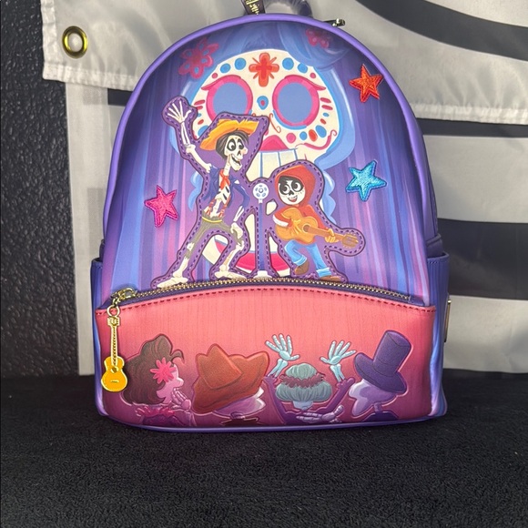 Loungefly Handbags - Loungefly Pixar Coco glow-in-the-dark mini backpack